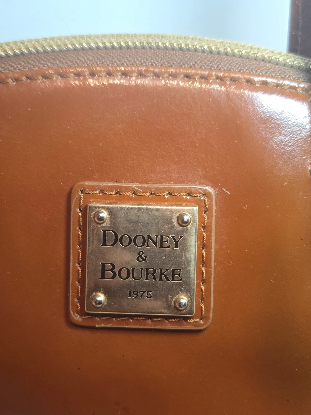 Dooney & Bourke Cognac Patent Leather Satchel with Gold Plaque